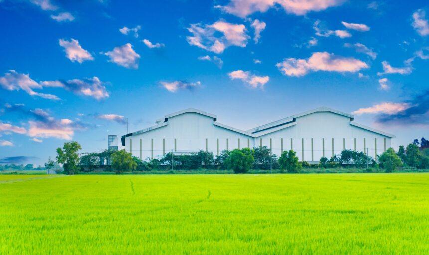 factory-with-green-fields-and-bright-sky-nature-b-2023-11-27-05-25-45-utc