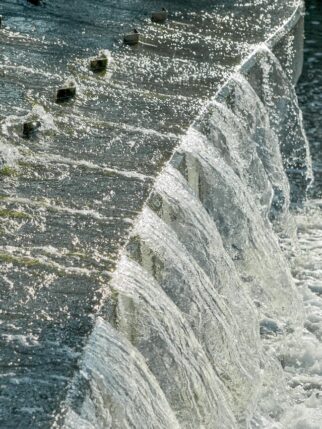 sparkling water flowing over a man made water-feature