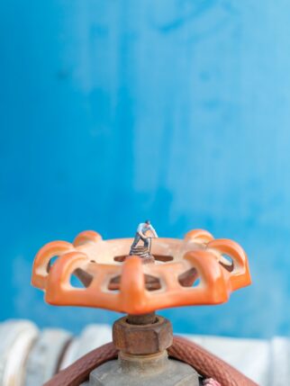 tiny-figure-repairs-gigantic-orange-valve-mechanis-2026-03-26-07-43-37-utc